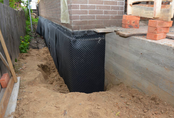Happy homeowners after waterproofing job in Cobb Island